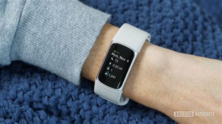 How do I sync my Fitbit with the dongle?