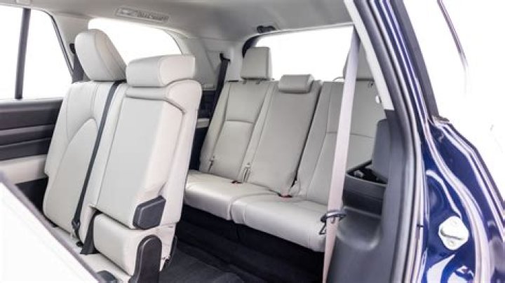 How do you put the back seats down in a Toyota Highlander?