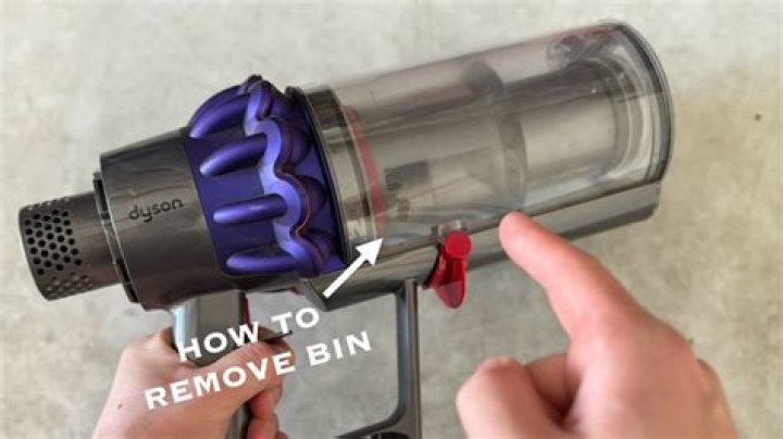 How do you put the bin back on a Dyson v10?