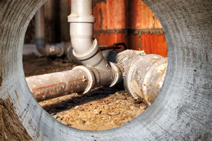 How do you tie into an existing sewer pipe?