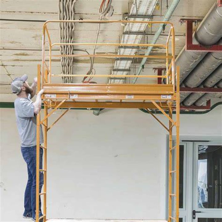 How high should scaffold guard rails be?