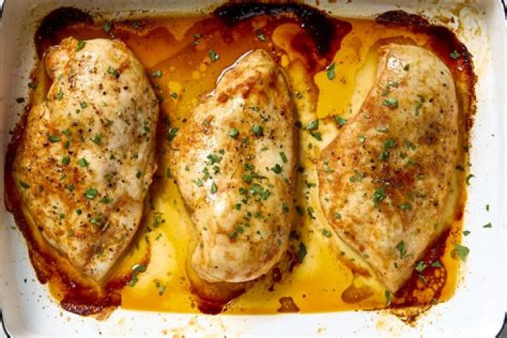 How long do you reheat chicken breasts in the oven?