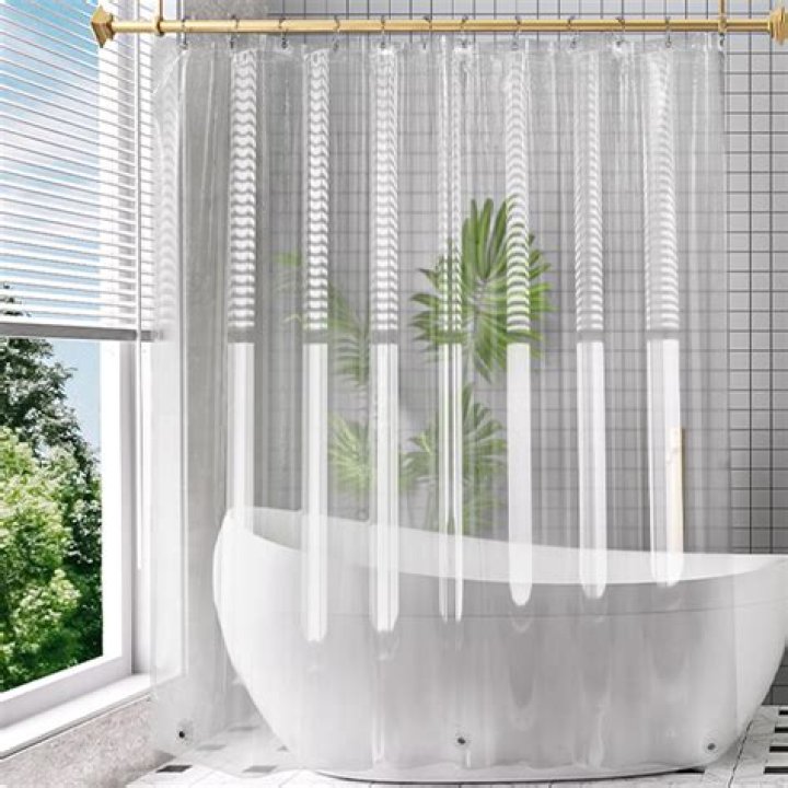 Is it safe to wash a plastic shower curtain in the washing machine?