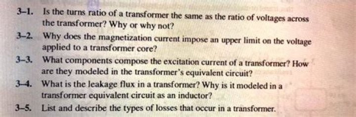 What components compose the excitation current of a transformer?