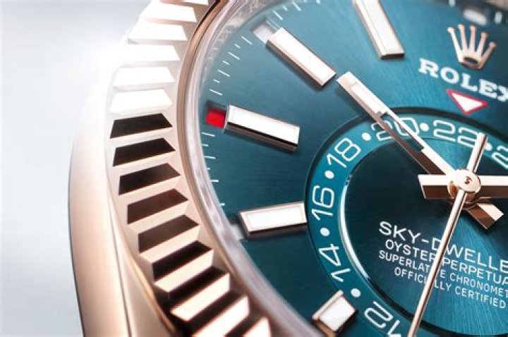 What is the red dot on the Rolex Sky Dweller?