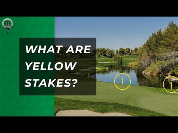 What is the rule for yellow stakes in golf?