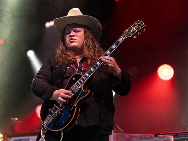 Who plays guitar on Texas sun?