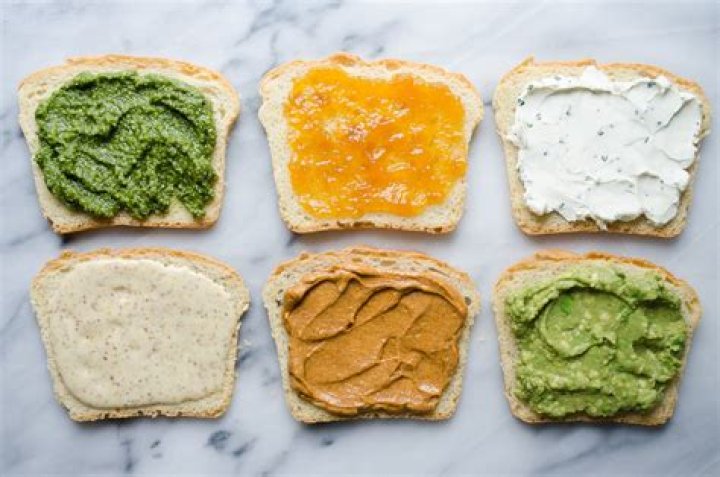 Why are spreads used in sandwiches?