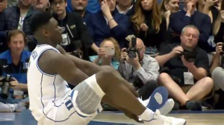 Why do basketball players touch the bottom of their shoes?